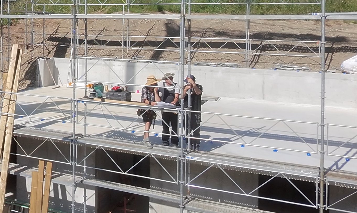 Team on site discussing project plans