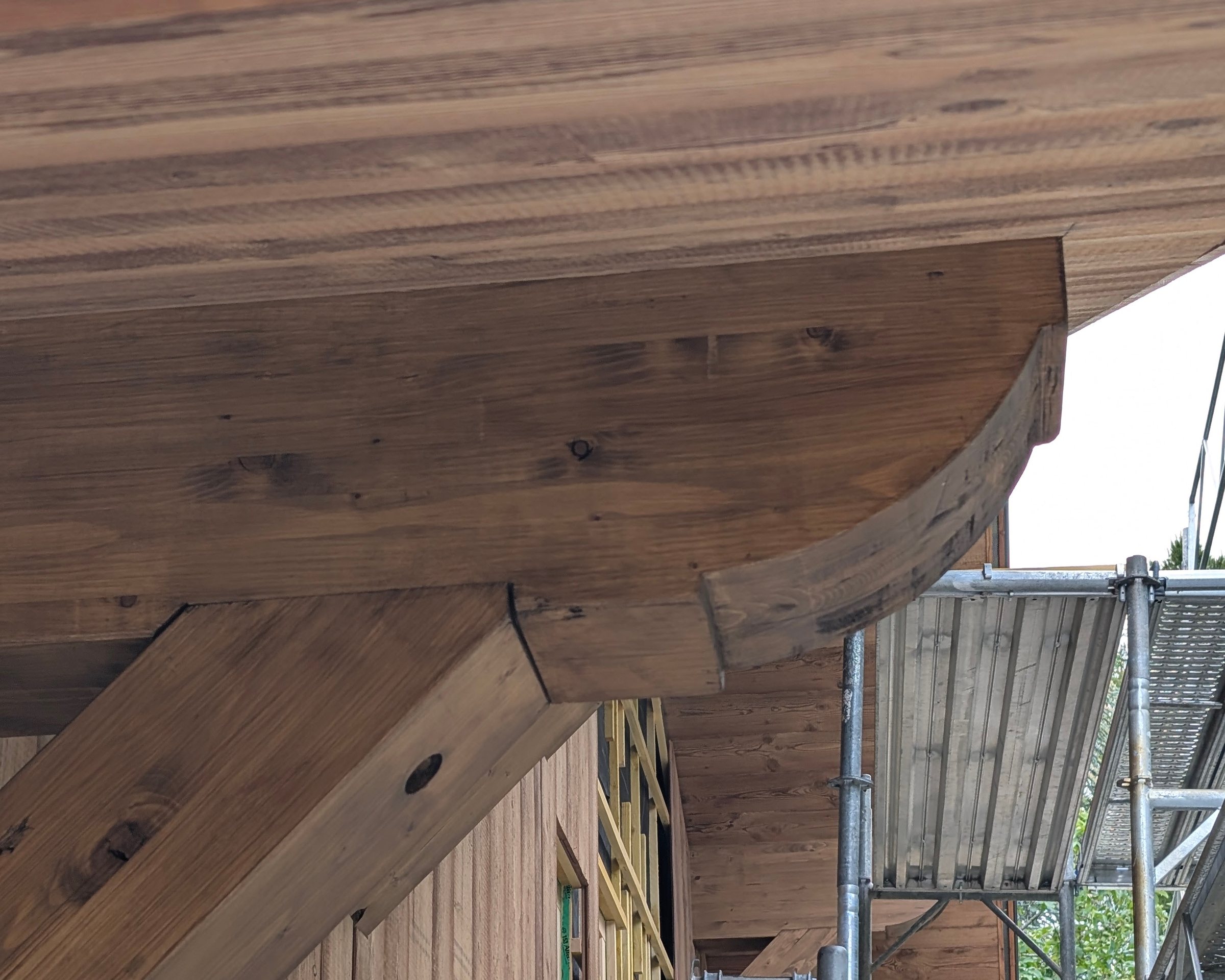 Bracket with detail supporting the roof