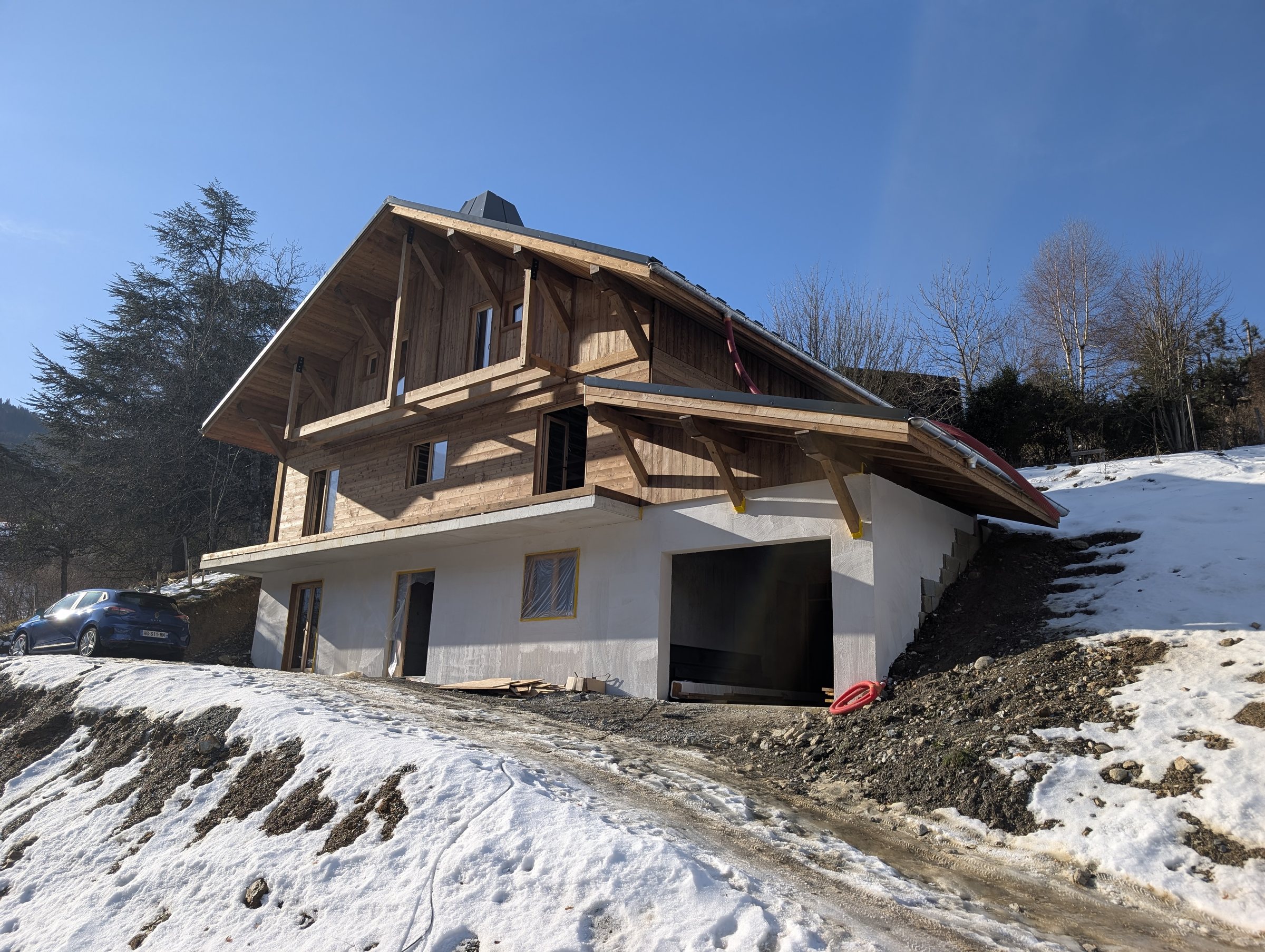 The finished roof, larch cladding and windows on Chalet Miage